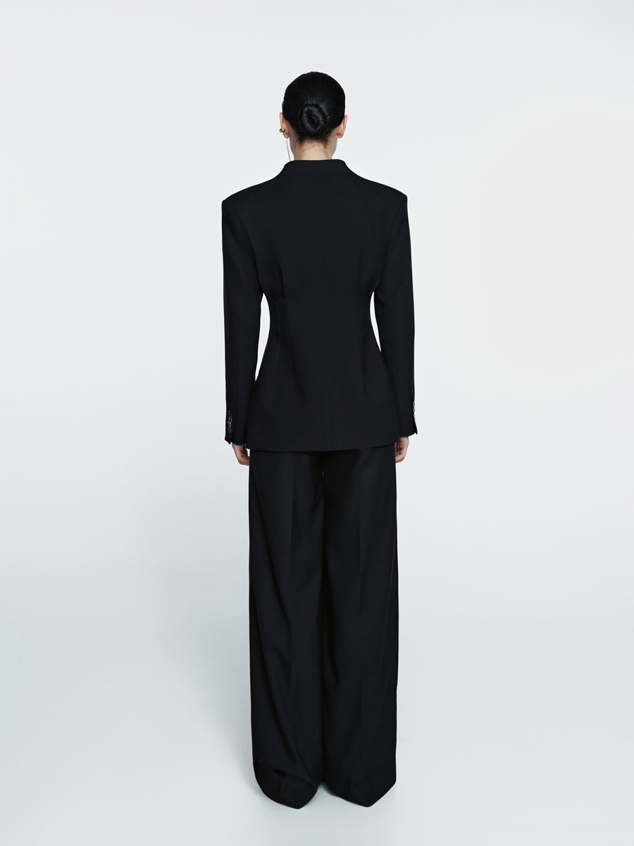 Loose-cut trousers with pleats